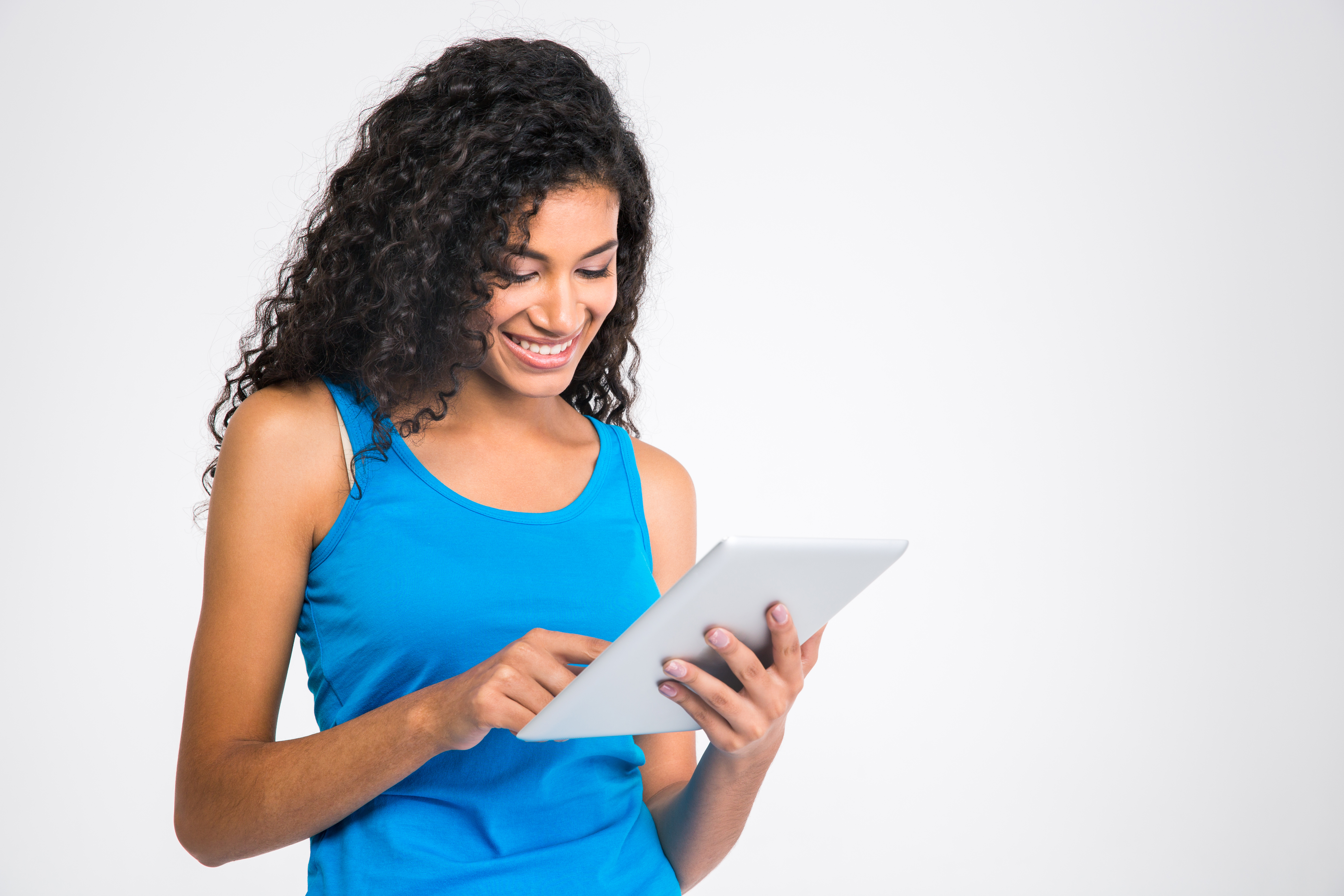 Portrait of a smiling woman using tablet computer